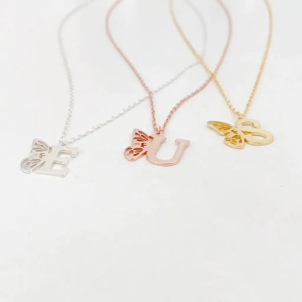 Personalized 18K gold Butterfly Initial Birthstone Necklace Designed and handcrafted in Dubai, the UAE.