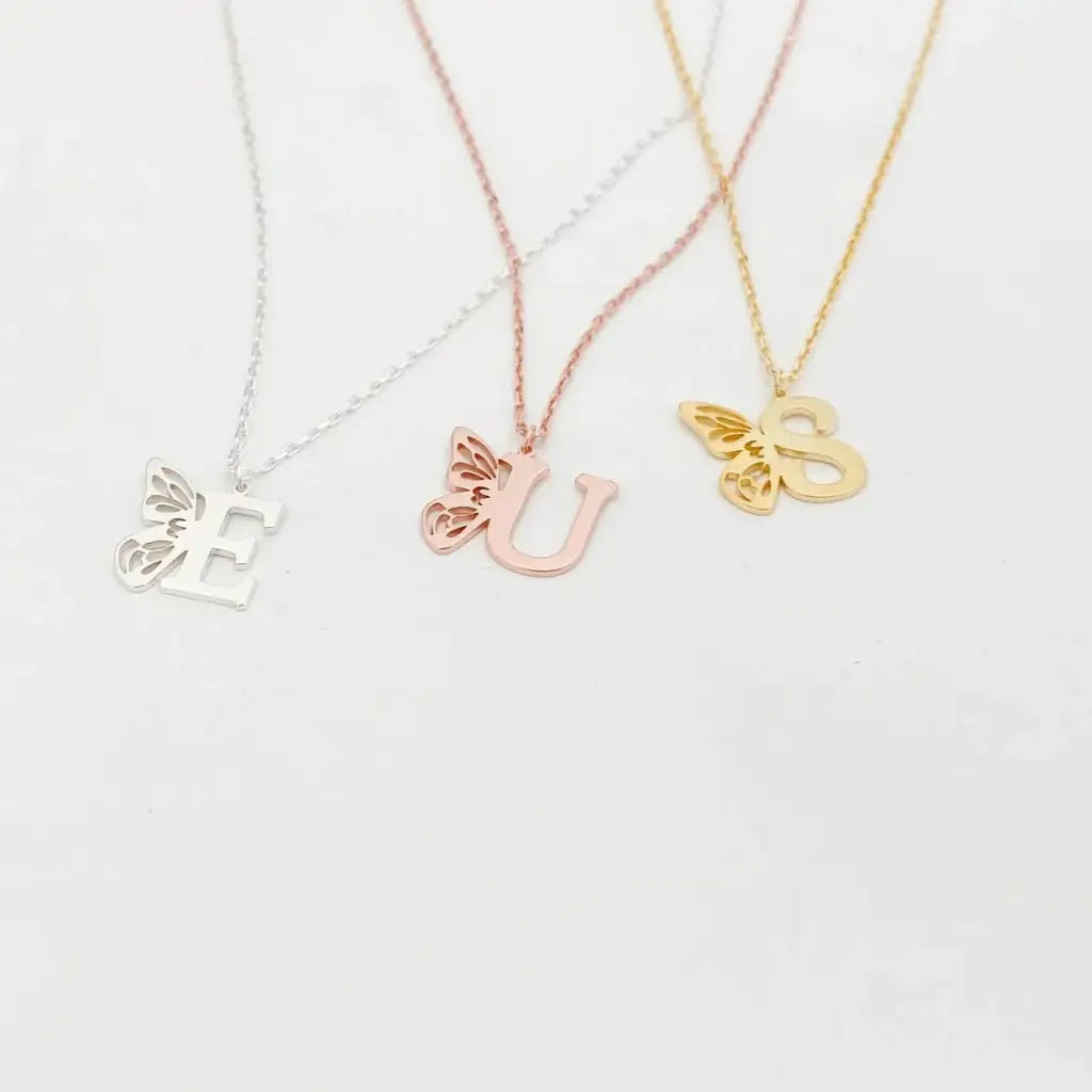 Personalized 18K gold Butterfly Initial Birthstone Necklace Designed and handcrafted in Dubai, the UAE.