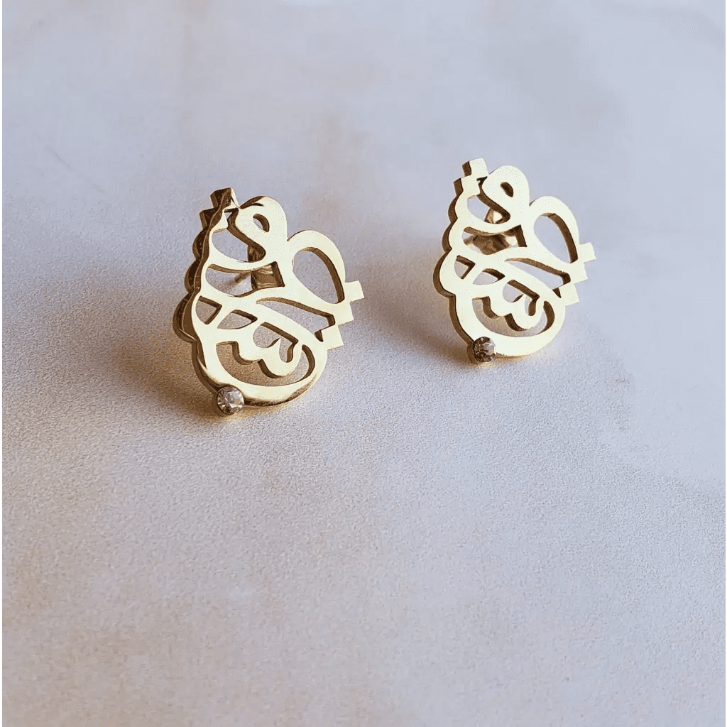 Arabian calligraphy earrings made in real gold. Designed and handcrafted in the UAE. These gorgeous authentic calligraphy earrings are locally handcrafted with the highest quality materials and artisans available in Dubai.