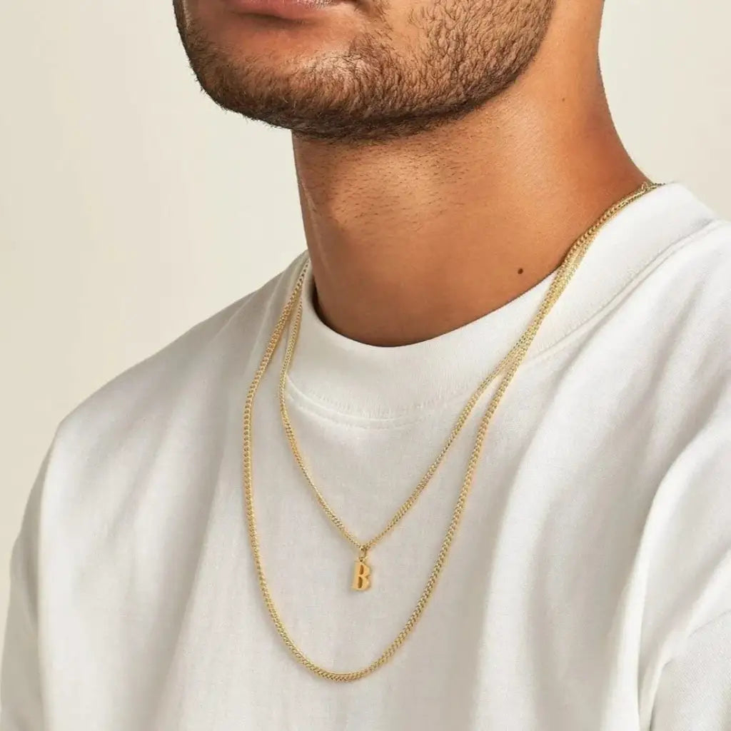Trendy and elegant, this stunning gold alphabet pendant has a playful charm. Attached to a box chain made of genuine solid gold and personalized with the initial of your choice. A thoughtful luxury anniversary gift for your boyfriend or husband, and the perfect expensive birthday gift for a father or a brother.