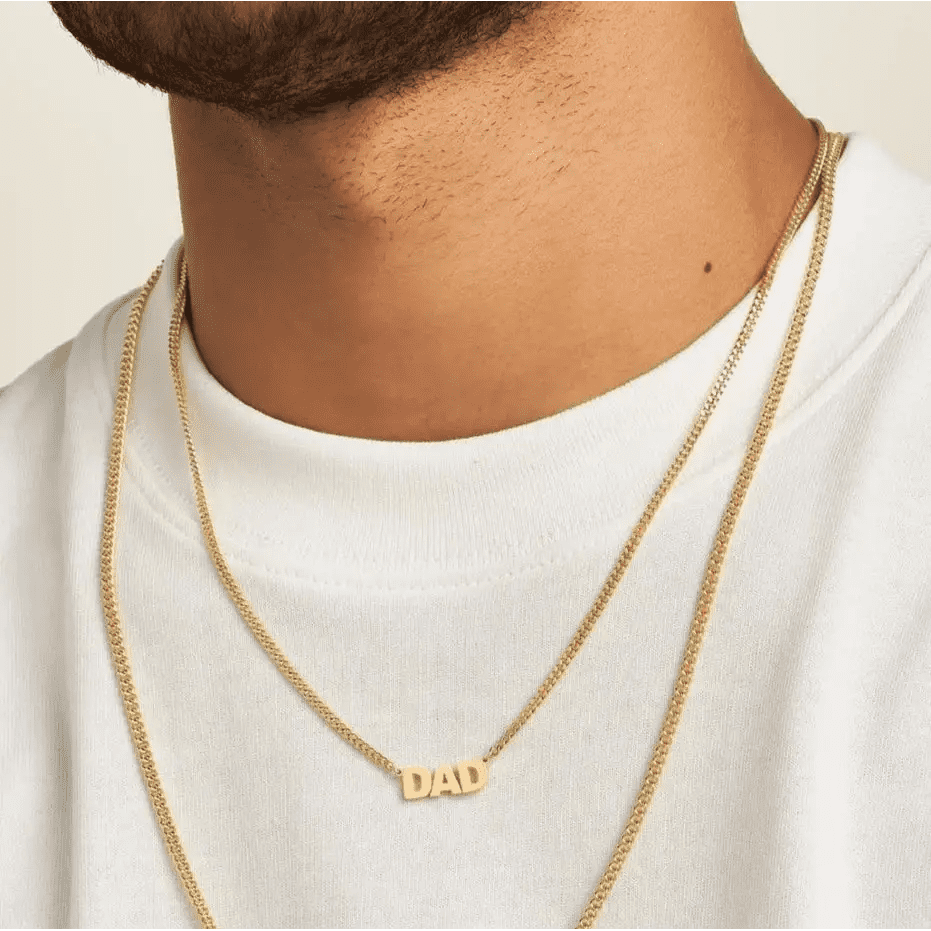 Luxury Gold Custom Name Necklace for men made of genuine 18k solid gold and personalized with the words of your choice. A thoughtful luxury anniversary gift for your boyfriend or husband, and the perfect expensive birthday gift for a father or a brother.