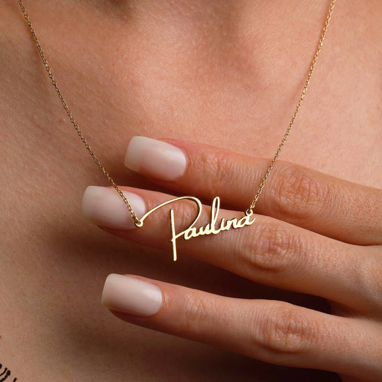 Gold Personalized Name Necklace Designed and handcrafted in the UAE. This classic gold name necklace is locally handcrafted with the highest quality materials and artisans available in Dubai. Perfect gift for a best friend, lover and family.