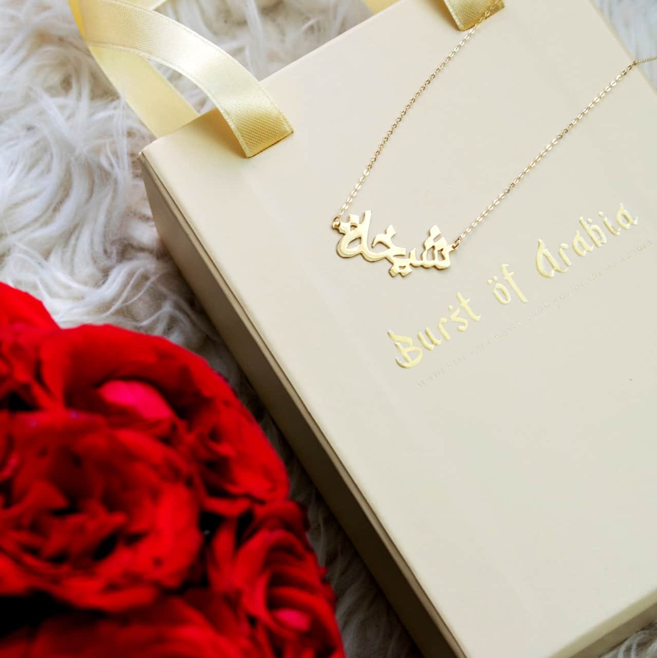 Two initial heart necklace, designed in 18-carat gold.