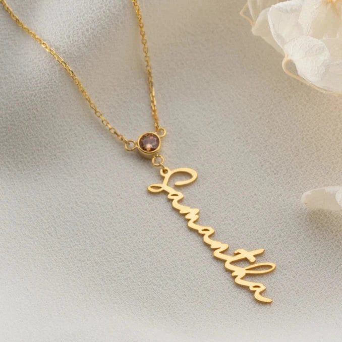 Personalized gold name necklace with birthstone detail, available for worldwide shipping