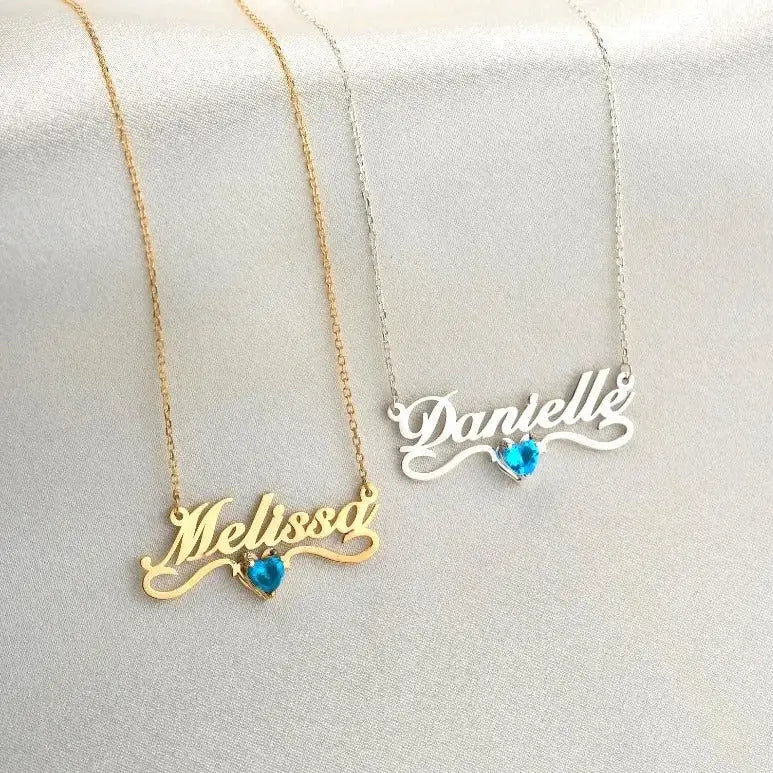 Gold Heart-shaped Birthstone Necklace - available in gold. Made in real gold, this birthstone heart-shaped name necklace is locally handcrafted with the highest quality materials and artisans available in Dubai.  Great addition to your jewelry collection and is also the ideal gift for a loved one.