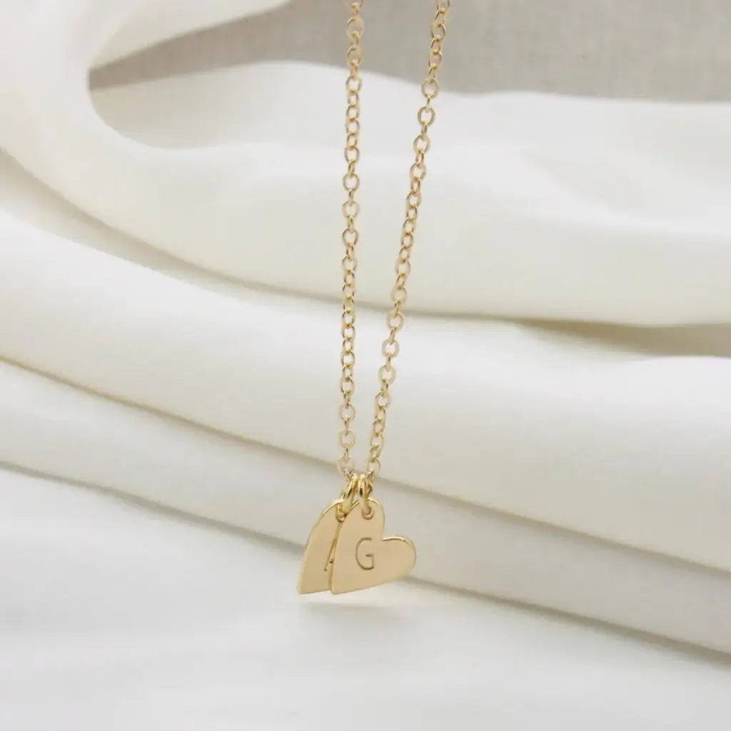 Gold Heart-shaped Initial Necklace Personalized, designed and handcrafted in the UAE. This fine and minimal heart initial necklace is locally handcrafted with the highest quality materials and artisans available in Dubai. 