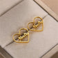 Gold Heart-shaped Hoop Earrings. Designed and handcrafted in the UAE. This fine pair of Gold Heart-shaped Hoop Earrings is locally handcrafted with the highest quality materials and artisans available in Dubai. 