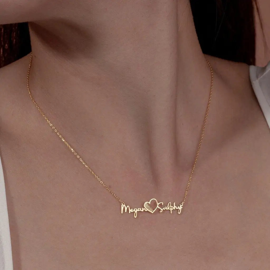 Gold Multiple Name Heart Necklace - available in gold. Made in real gold, this fine name necklace is locally handcrafted with the highest quality materials and artisans available in Dubai.  Great addition to your jewelry collection and is also the ideal wedding or anniversary gift for a loved one.