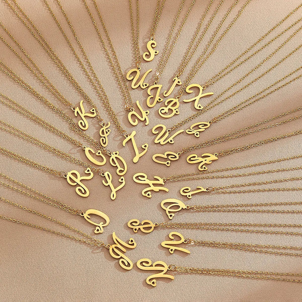 Gold initial letter heart necklace - made in real solid gold. The perfect gift for your loved ones and is also great for layering with other necklaces or minimalist wear. Can be personalized in Arabic or English. Crafted to the highest standards and is made at our jewelry workshop in Dubai at the United Arab Emirates.