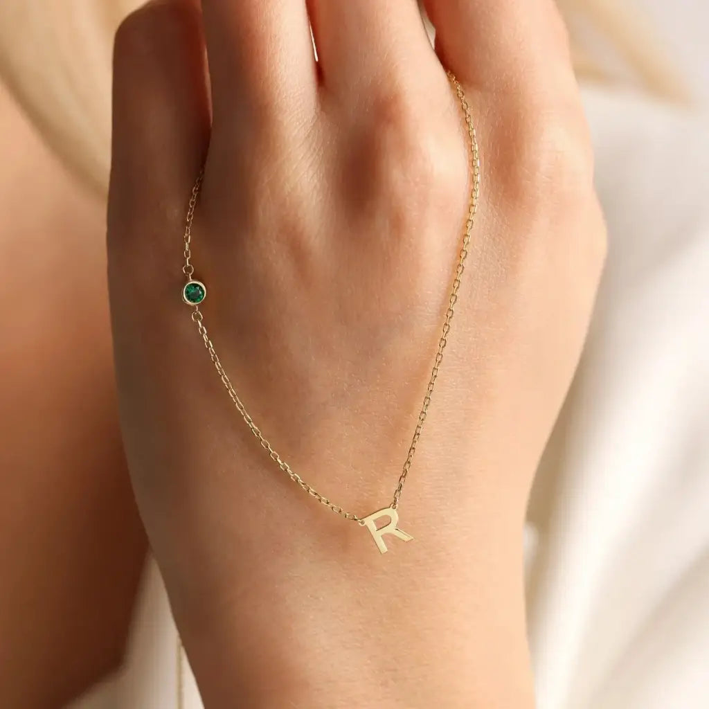 18K Gold initial letter necklace - made in real solid gold. Great for layering with other necklaces or minimalist wear. Can be personalized in Arabic or English.  Crafted to the highest standards and is made at our jewelry workshop in Dubai at the United Arab Emirates.