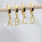 Personalized Initial Letter Hoop Earrings. Designed and handcrafted in the UAE. These gold alphabet initial earrings are locally handcrafted with the highest quality materials and artisans available in Dubai. 