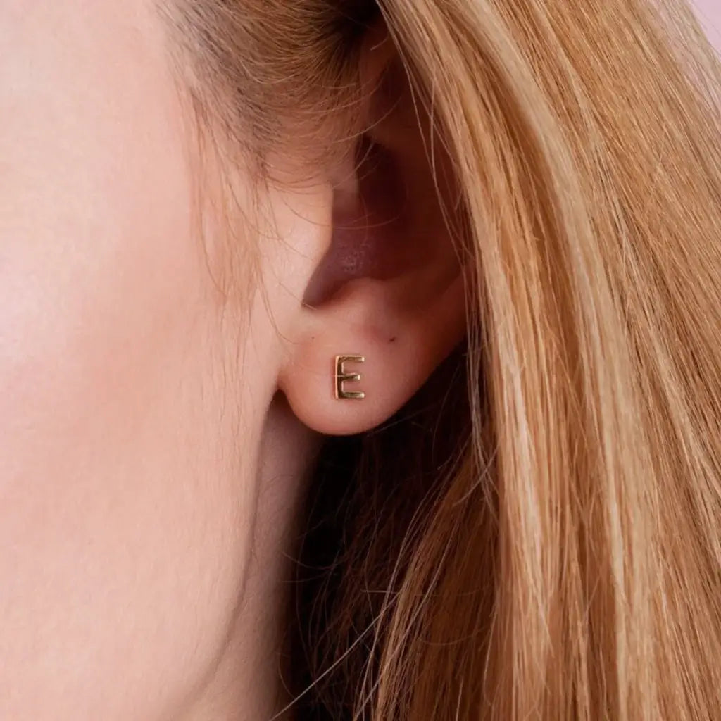 A beautiful pair of English alphabet gold initial earrings, handcrafted with a modern and minimal design that will shine radiantly and captures the eye with its charismatic brilliance. Adaptable to any style, and perfect to wear on any occasion. Beautifully handmade to the highest standards in the United Arab Emirates.