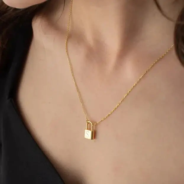 Gold Initial Padlock Necklace Personalized, designed and handcrafted in the UAE. Delivers within 2 to 5 business days.  This stunning gold Initial padlock necklace is locally handcrafted with the highest quality materials and artisans available in Dubai. 