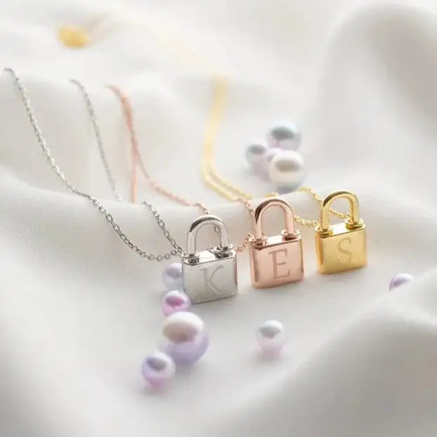 Gold Initial Padlock Necklace Personalized, designed and handcrafted in the UAE. Delivers within 2 to 5 business days.  This stunning gold Initial padlock necklace is locally handcrafted with the highest quality materials and artisans available in Dubai. 