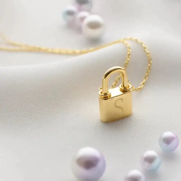 Gold Initial Padlock Necklace Personalized, designed and handcrafted in the UAE. Delivers within 2 to 5 business days.  This stunning gold Initial padlock necklace is locally handcrafted with the highest quality materials and artisans available in Dubai. 