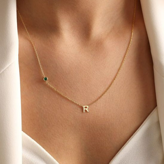 18K Gold initial letter necklace - made in real solid gold. Great for layering with other necklaces or minimalist wear. Can be personalized in Arabic or English. Crafted to the highest standards and is made at our jewelry workshop in Dubai at the United Arab Emirates.