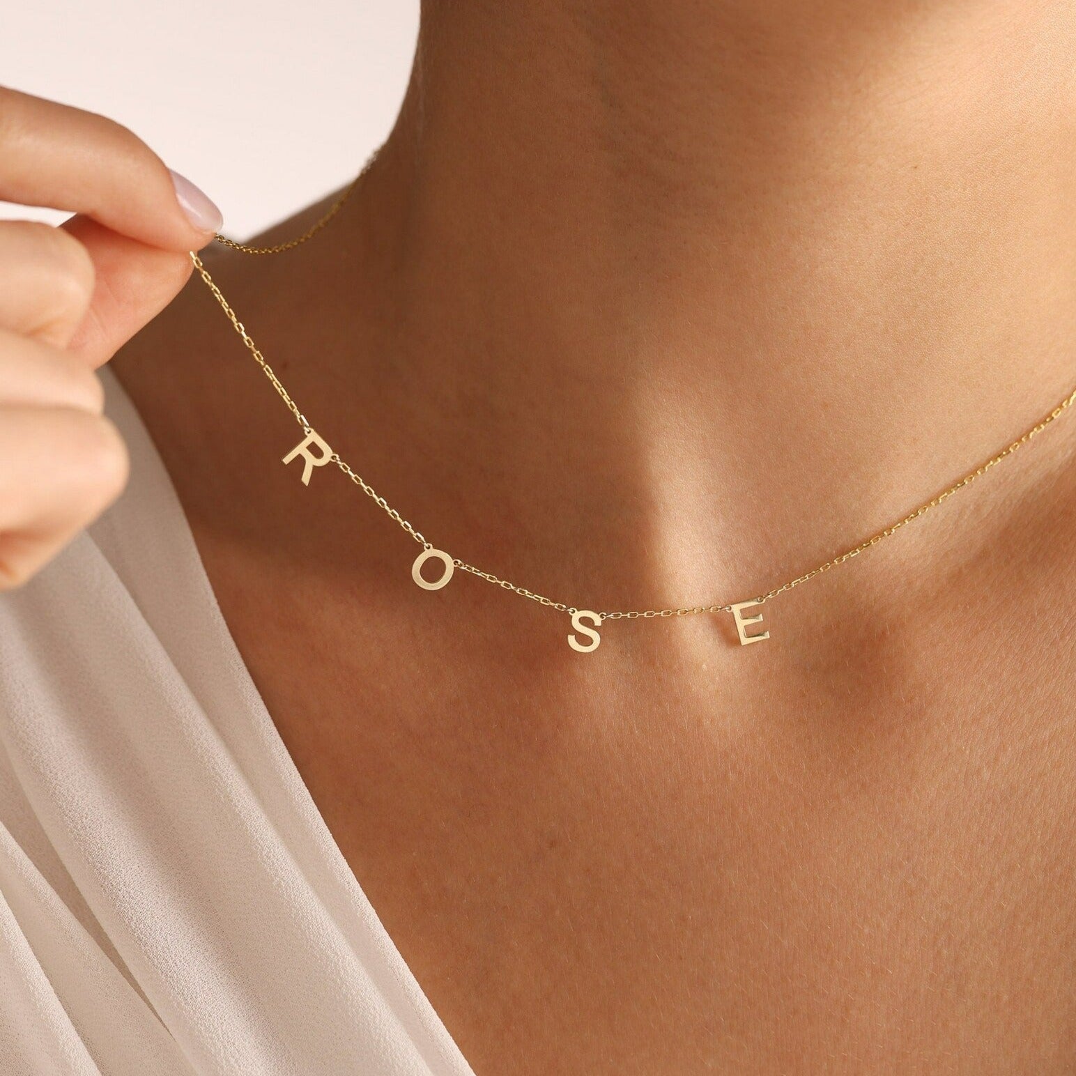 Gold Alphabet Letter Necklace Customized and handcrafted in the UAE.