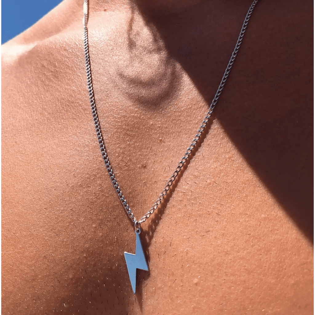 Luxury Gold Lightning Bolt Name Necklace for him made of genuine 18k solid gold. A thoughtful luxury anniversary gift for your boyfriend or husband, and the perfect expensive birthday gift for a father or a brother.