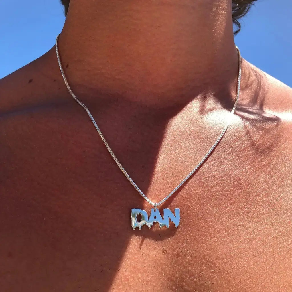 Luxury gold name necklace for him made of genuine 18k solid gold and personalized with the initials/words of your choice. A thoughtful luxury anniversary gift for your boyfriend or husband, and the perfect expensive birthday gift for a father or a brother.