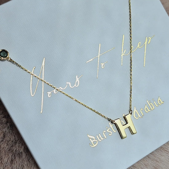 18K Gold initial letter necklace - made in real solid gold. Great for layering with other necklaces or minimalist wear. Can be personalized in Arabic or English.  Crafted to the highest standards and is made at our jewelry workshop in Dubai at the United Arab Emirates.