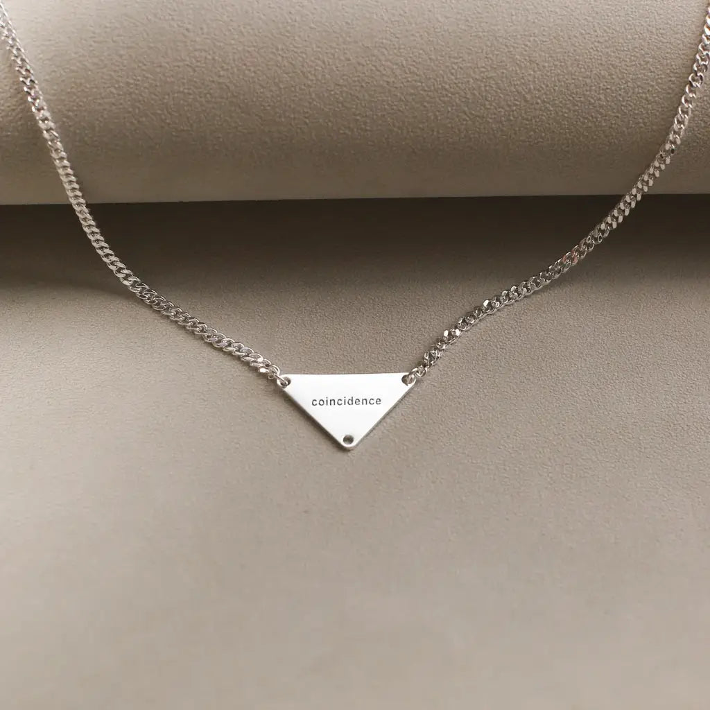 Luxury Gold Pyramid-shaped Name Necklace for him made of genuine 18k solid gold and personalized with the letters/numbers of your choice. A thoughtful luxury anniversary gift for your boyfriend or husband, and the perfect expensive birthday gift for a father or a brother.