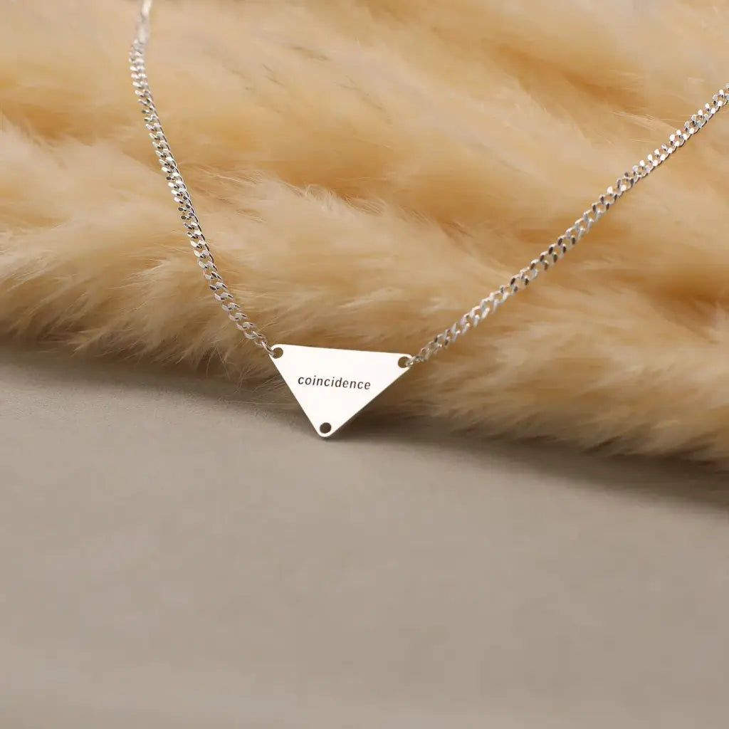 Luxury Gold Pyramid-shaped Name Necklace for him made of genuine 18k solid gold and personalized with the letters/numbers of your choice. A thoughtful luxury anniversary gift for your boyfriend or husband, and the perfect expensive birthday gift for a father or a brother.