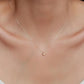 A delicate gold chain necklace with a small heart-shaped pendant.