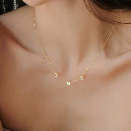 Gold Heart Letter Initial Necklace Personalized, designed and handcrafted in the UAE. Delivers within 2 to 5 business days.  This fine and minimal sideways initial necklace is locally handcrafted with the highest quality materials and artisans available in Dubai. 