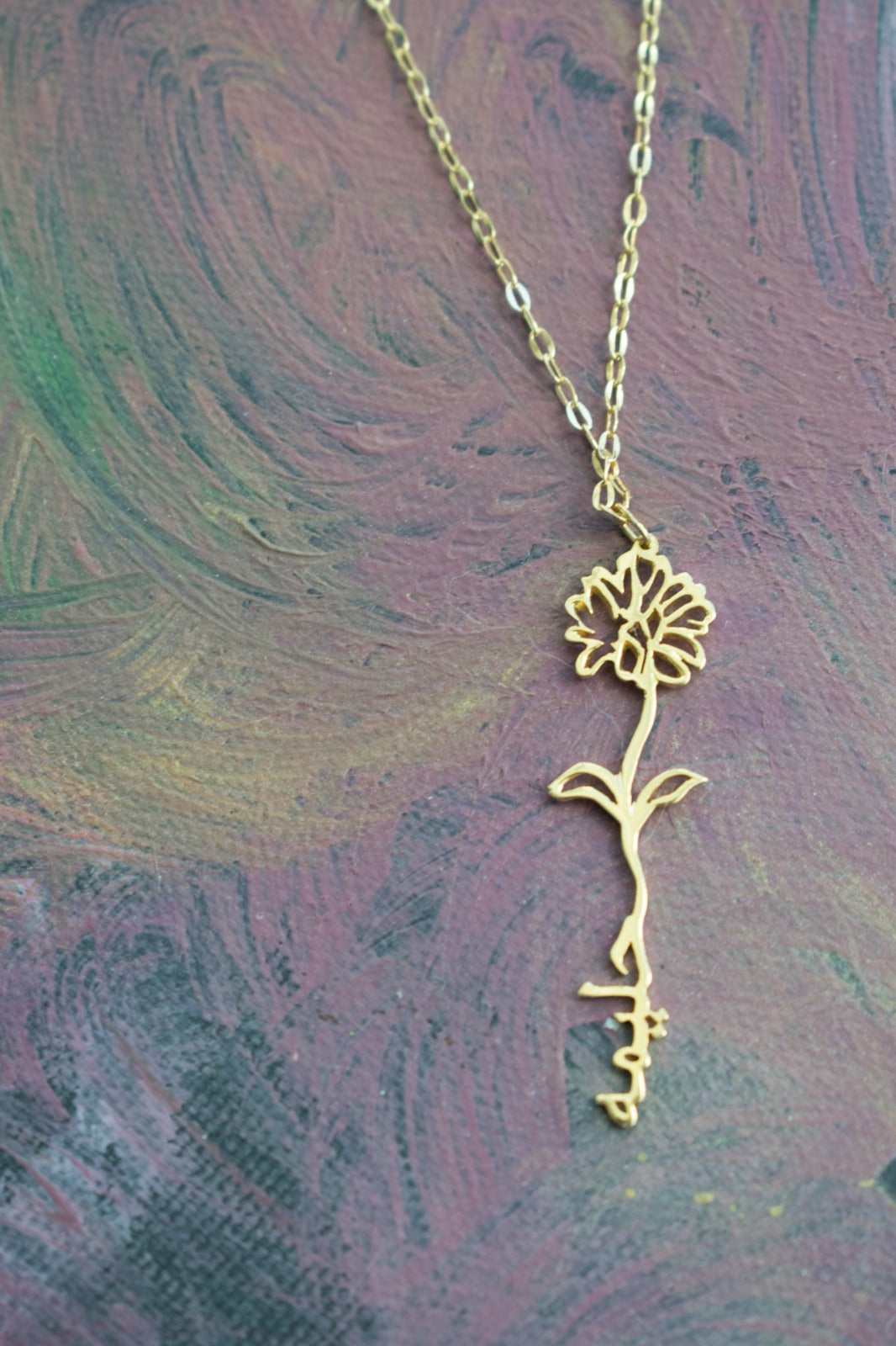 Birth flower name necklace, designed in 18 carat gold in Dubai, UAE