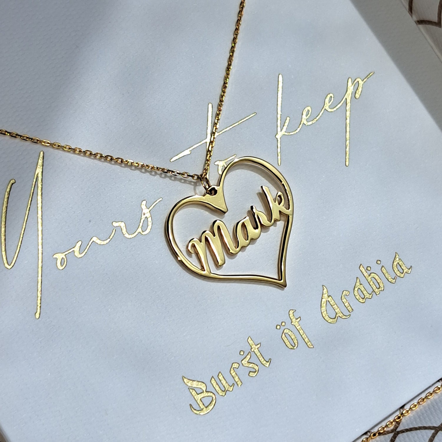 Heart shaped name necklace, designed and customized in the UAE in 18 carat gold.