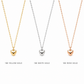 Three heart-shaped pendant necklaces displayed side by side on a white background, labeled 18K Yellow Gold, 18K White Gold, and 18K Rose Gold. The necklaces feature small polished heart pendants on delicate chains.