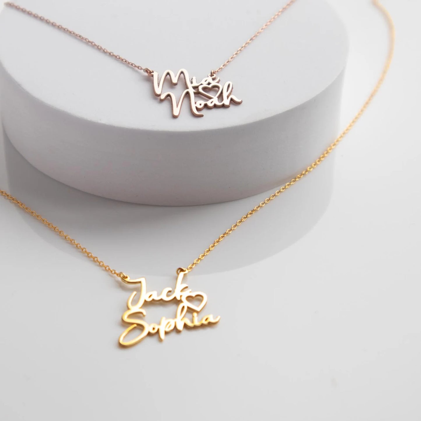 "Gold Two Names Necklace - A symbol of personalized elegance by Burst of Arabia. Crafted with precision, this exquisite piece adds a touch of individuality to your style. Order now for a uniquely cherished accessory."