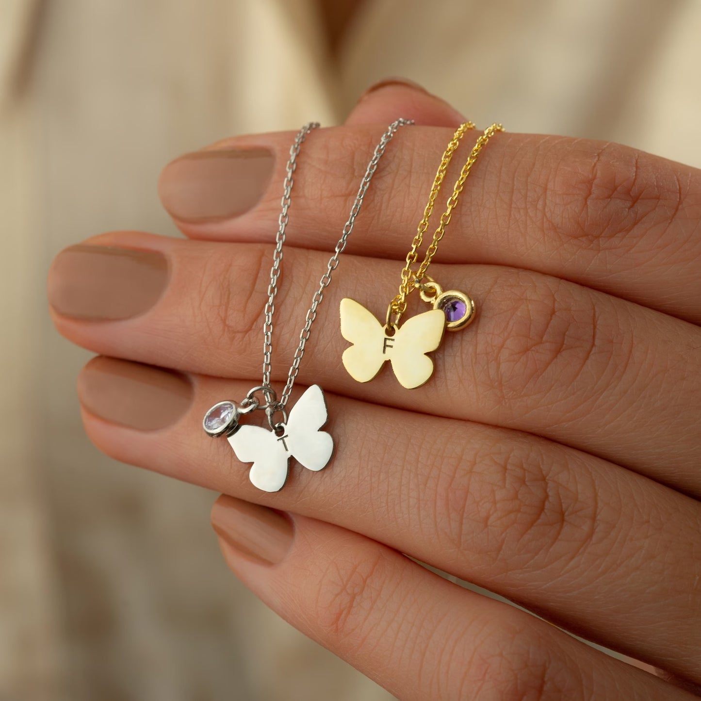 Personalized Gold Butterfly Initial Birthstone Necklace Designed and handcrafted in the UAE.  Pamper your loved one with this exquisite 18 carat gold butterfly initial birthstone necklace, complete with a delicate gold butterfly, birthstone and the initial of your choice.