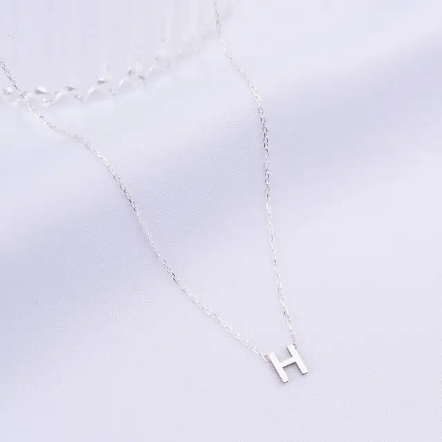 Gold Single Letter Initial Necklace Personalized, designed and handcrafted in the UAE. Delivers within 2 to 5 business days.  This fine and minimal single initial necklace is locally handcrafted with the highest quality materials and artisans available in Dubai. 