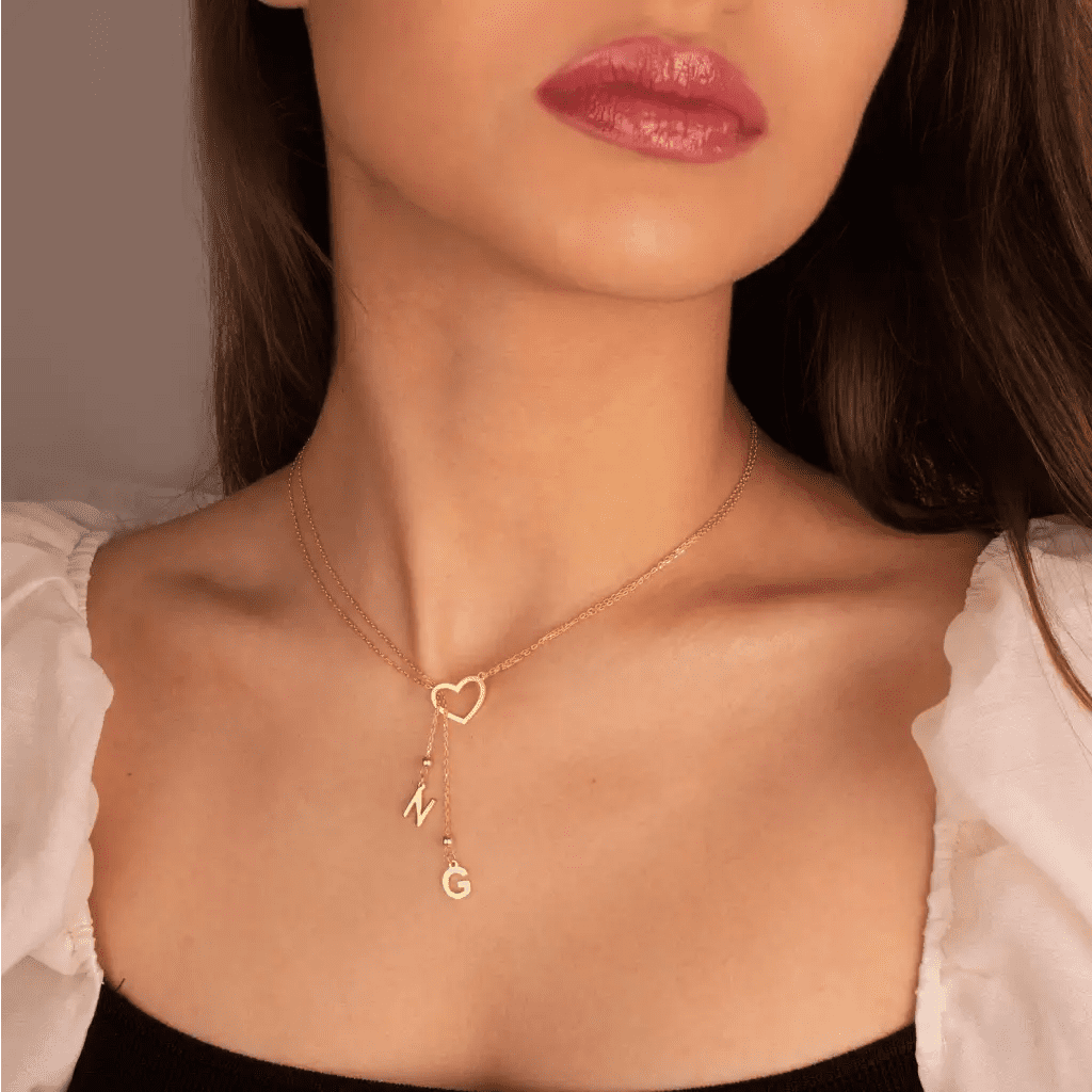 Trendy and elegant, this minimal gold alphabet pendant has a playful charm. This gold necklace is attached to a fine chain made of genuine solid gold and personalized with the initials of your choice. A great addition to your jewelry collection and a thoughtful gift for the loved ones.  Designed in Dubai.