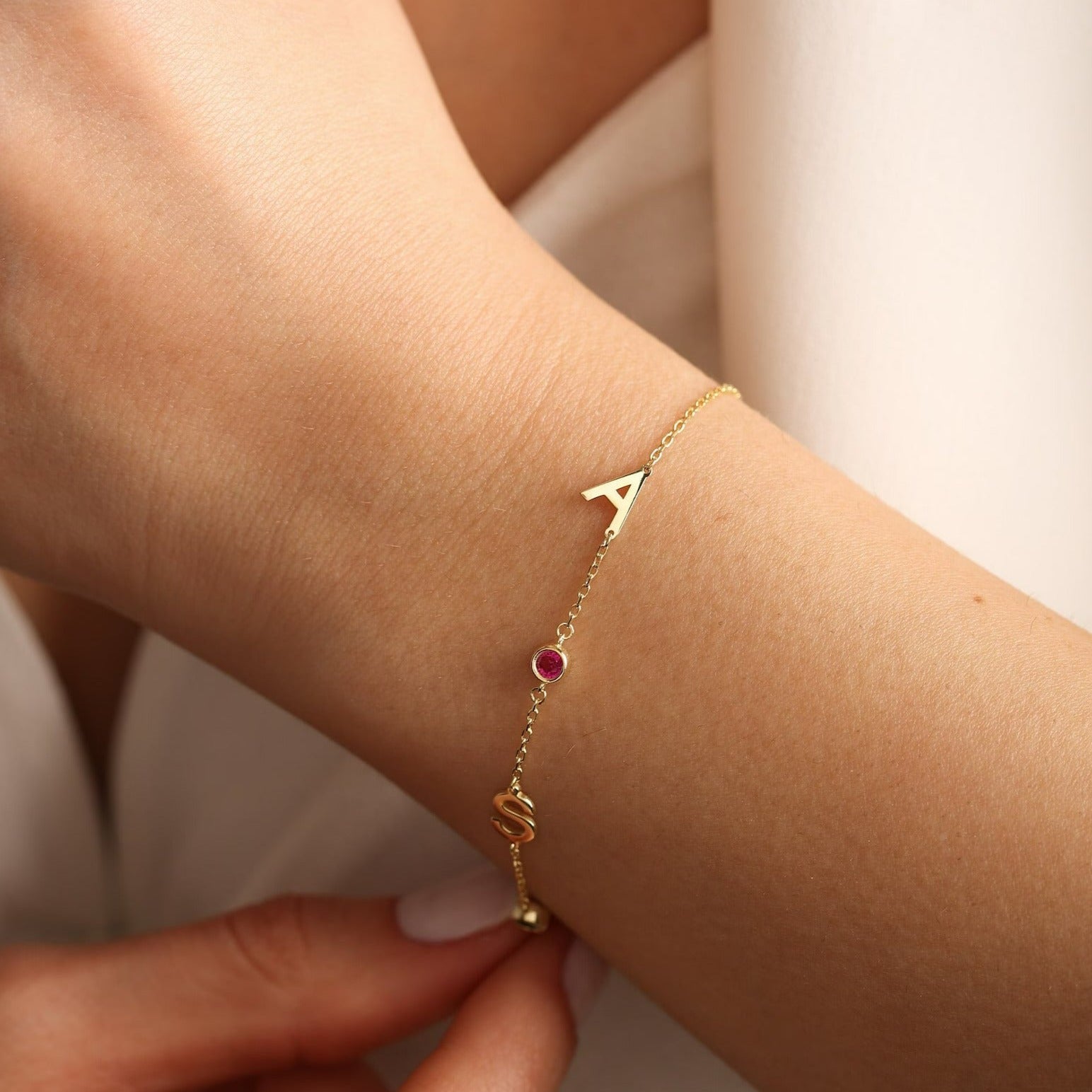 Two initial letter birthstone bracelet, anniversary gift for women, birthday gift for her. Handcrafted in Dubai, UAE.