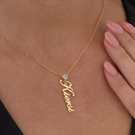 Personalized gold name necklace with birthstone detail, available for worldwide shipping