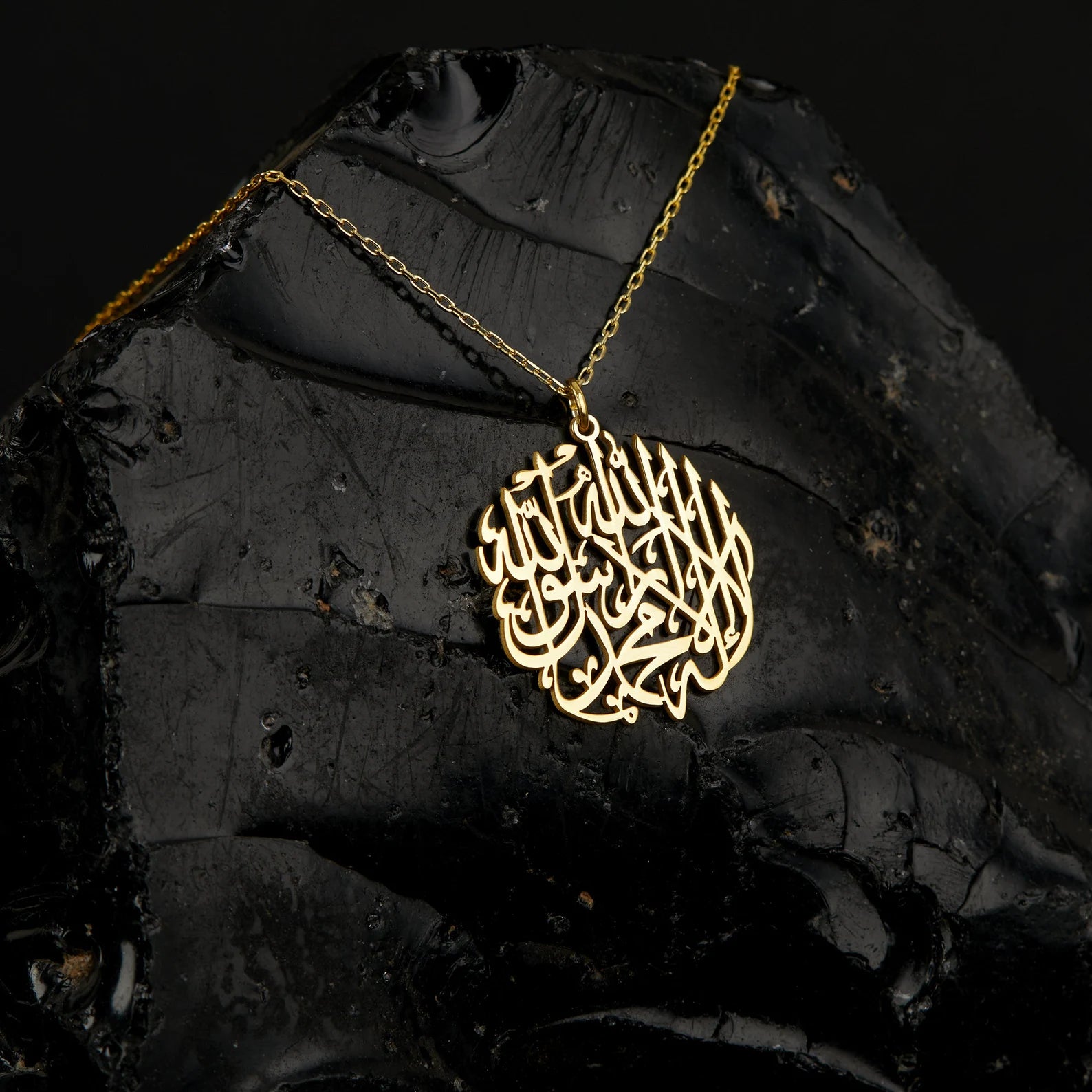 Arabian Islamic calligraphy pendant made in real gold. Designed and handcrafted in the UAE. This authentic pendant is locally handcrafted with the highest quality materials and artisans available in Dubai.