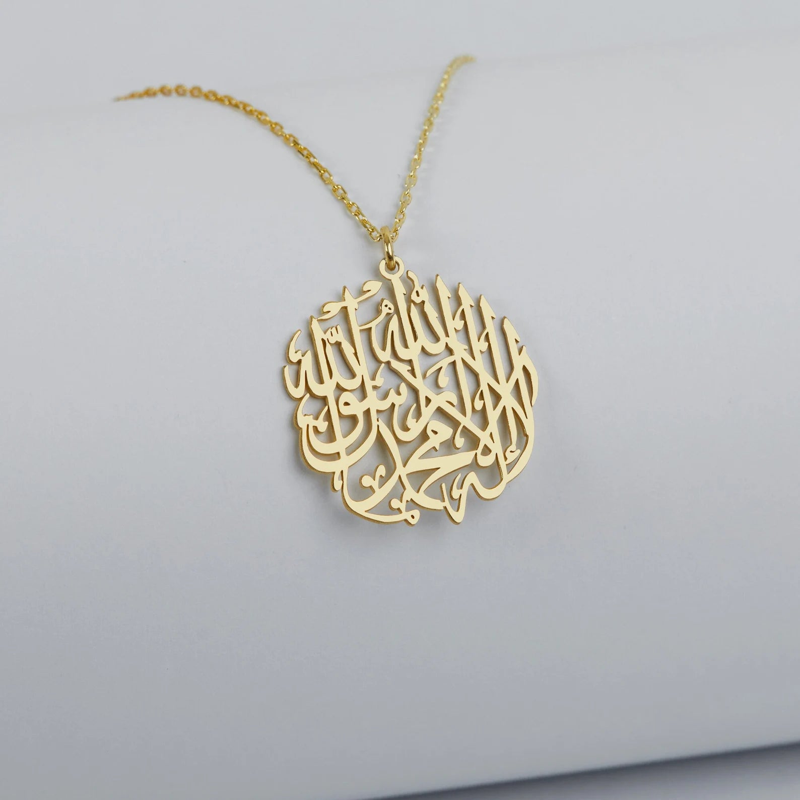 Arabian Islamic calligraphy pendant made in real gold. Designed and handcrafted in the UAE. This authentic pendant is locally handcrafted with the highest quality materials and artisans available in Dubai.